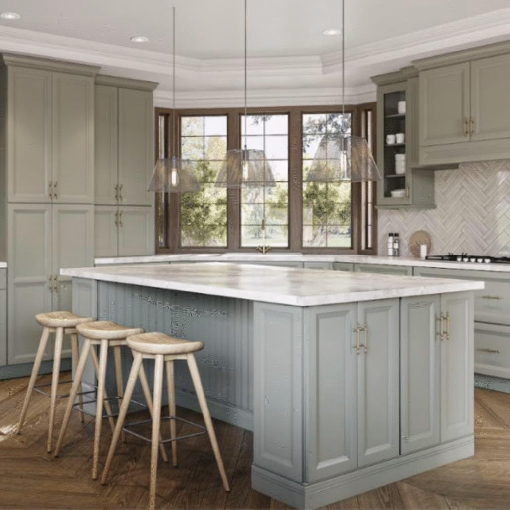 Sage green kitchen cabinets with island and wood flooring