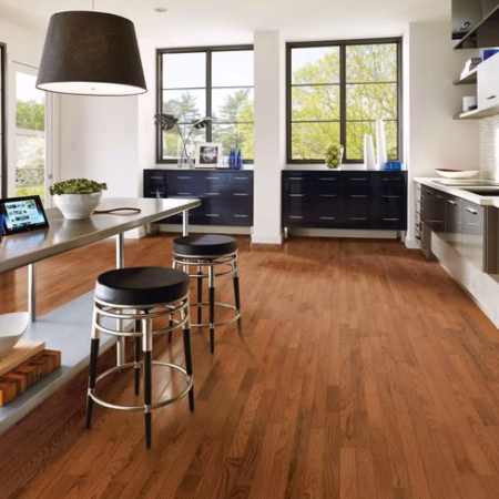 Hartco Prime Harvest Gunstock hardwood flooring installed in a room