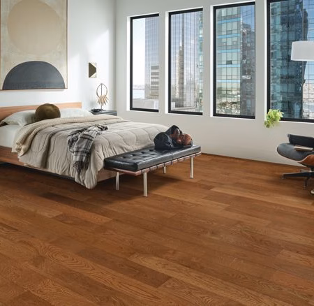 Armstrong Flooring Wanderer's Way Gunstock hardwood flooring installed in a room