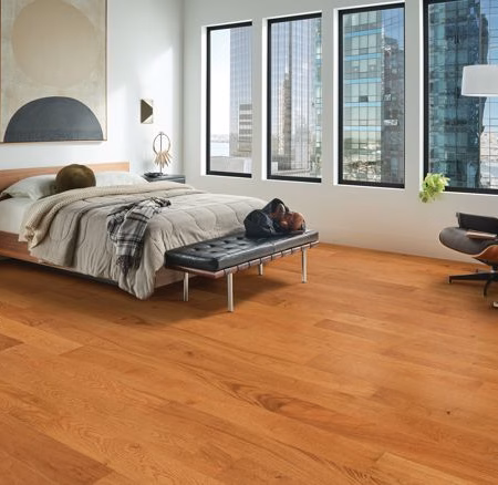 Armstrong Flooring Wanderer's Way Warm Caramel hardwood flooring installed in a room