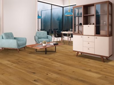 Quick-Step Centoria Canterbury Hickory showing warm golden hickory flooring in a furnished living room