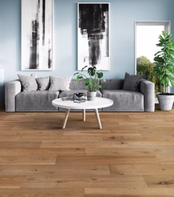 Quick-Step Centoria Tanbridge Hickory showing warm brown hickory flooring in a living room