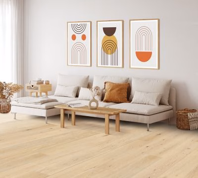 Quick-Step Perrano Fen Oak showing pale oak flooring in a bright living room
