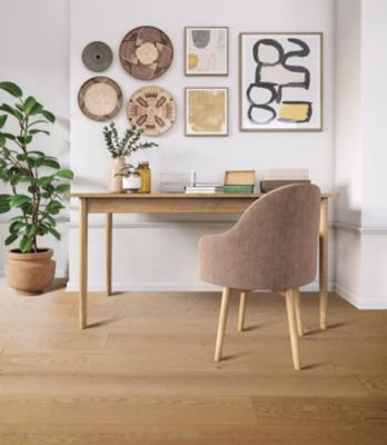 Quick-Step Trestina Yellow Clay Oak showing light golden oak flooring in a home office
